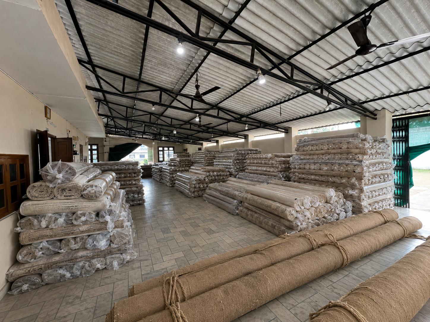 Warehouse of finished handmade rugs ready for export, Raheem and Son, Bhadohi India