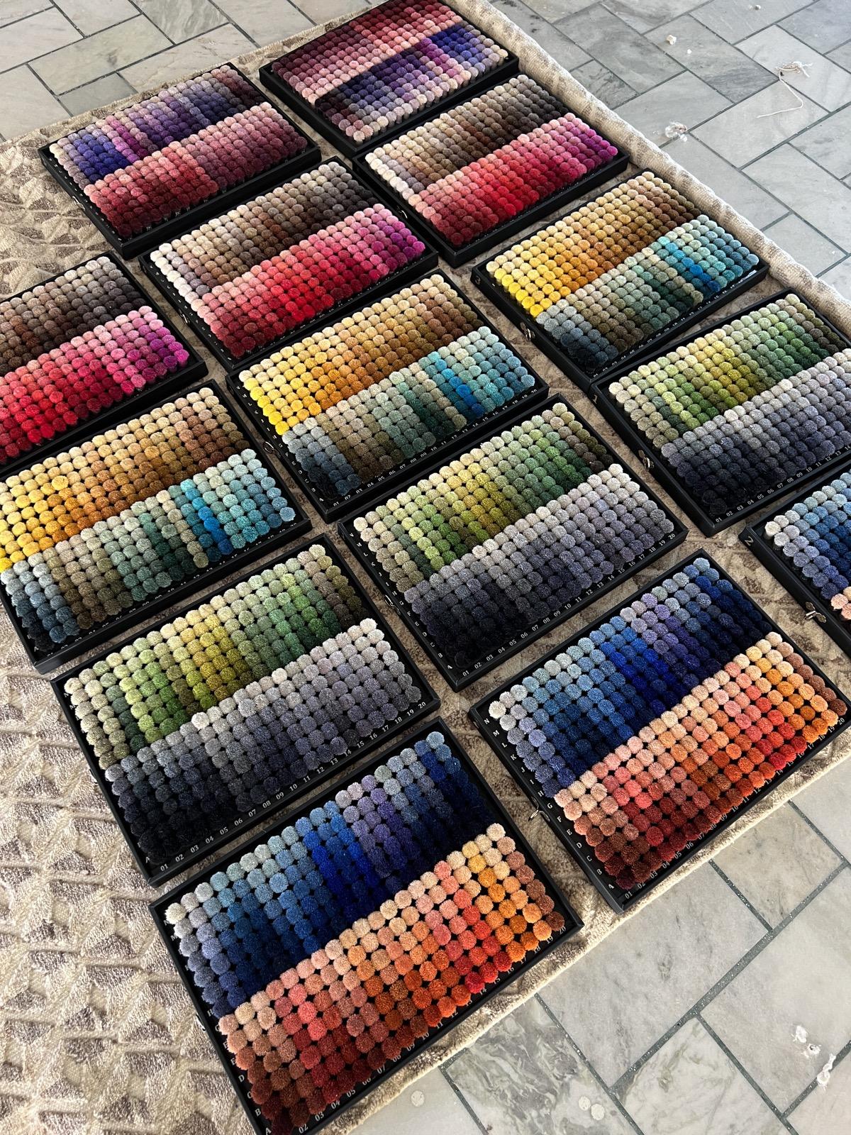 Rows of colour pom-pom sample trays, colour matching at Raheem and Son