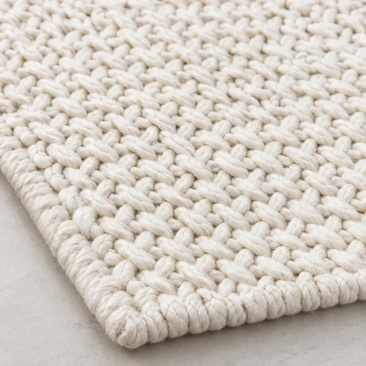 Close view of the Alder Rug in white showing its texture and detail