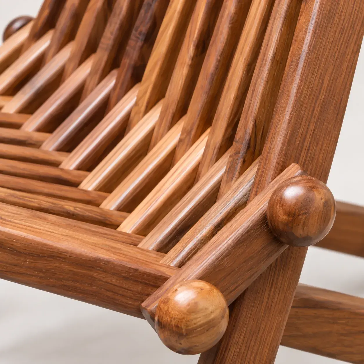 Bastien Folding Chair styled in a room, digitally rendered