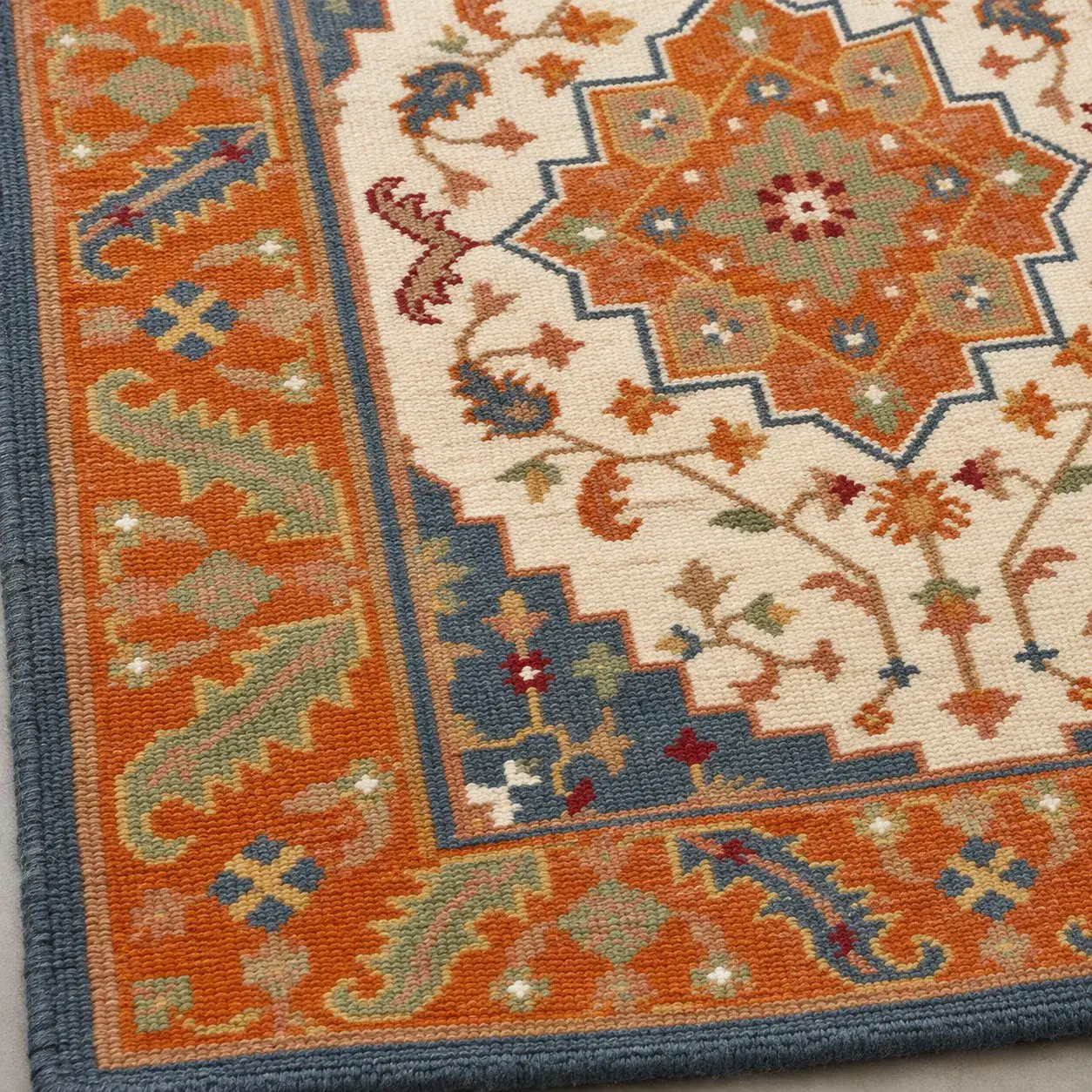 Close view of the Bianca Rug in orange blue showing its texture and detail