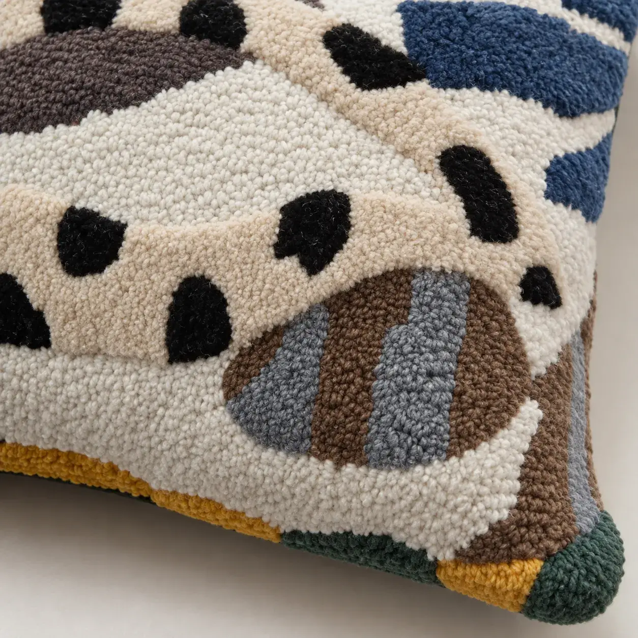 Close view of the Dominique Cushion Cover showing its texture and detail