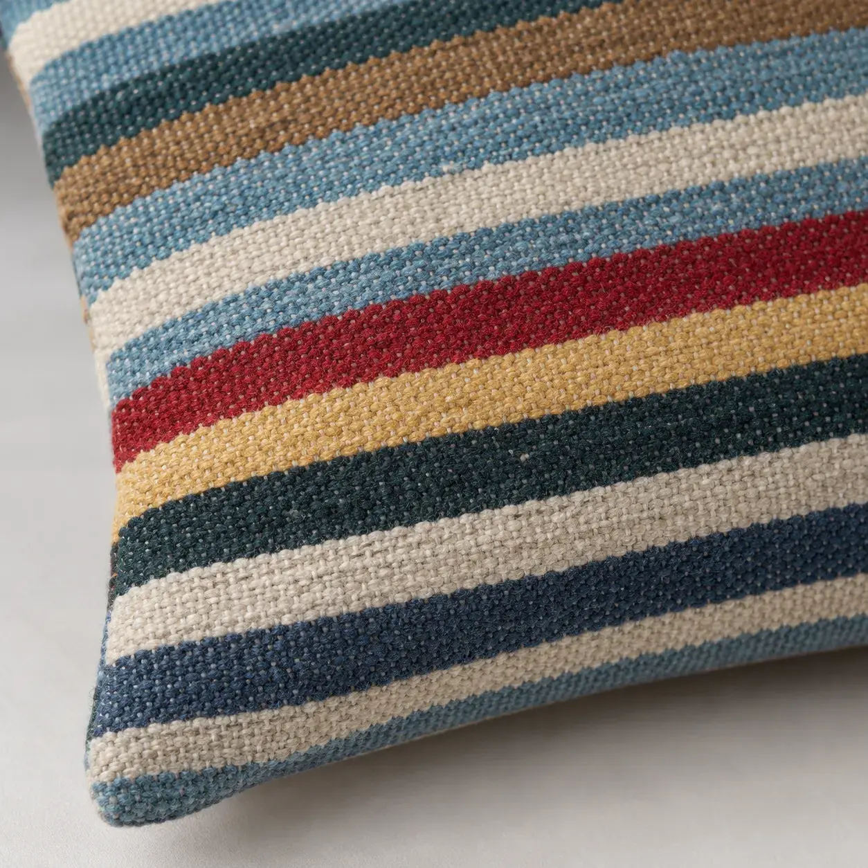 Close view of the Elio Cushion Cover showing its texture and detail