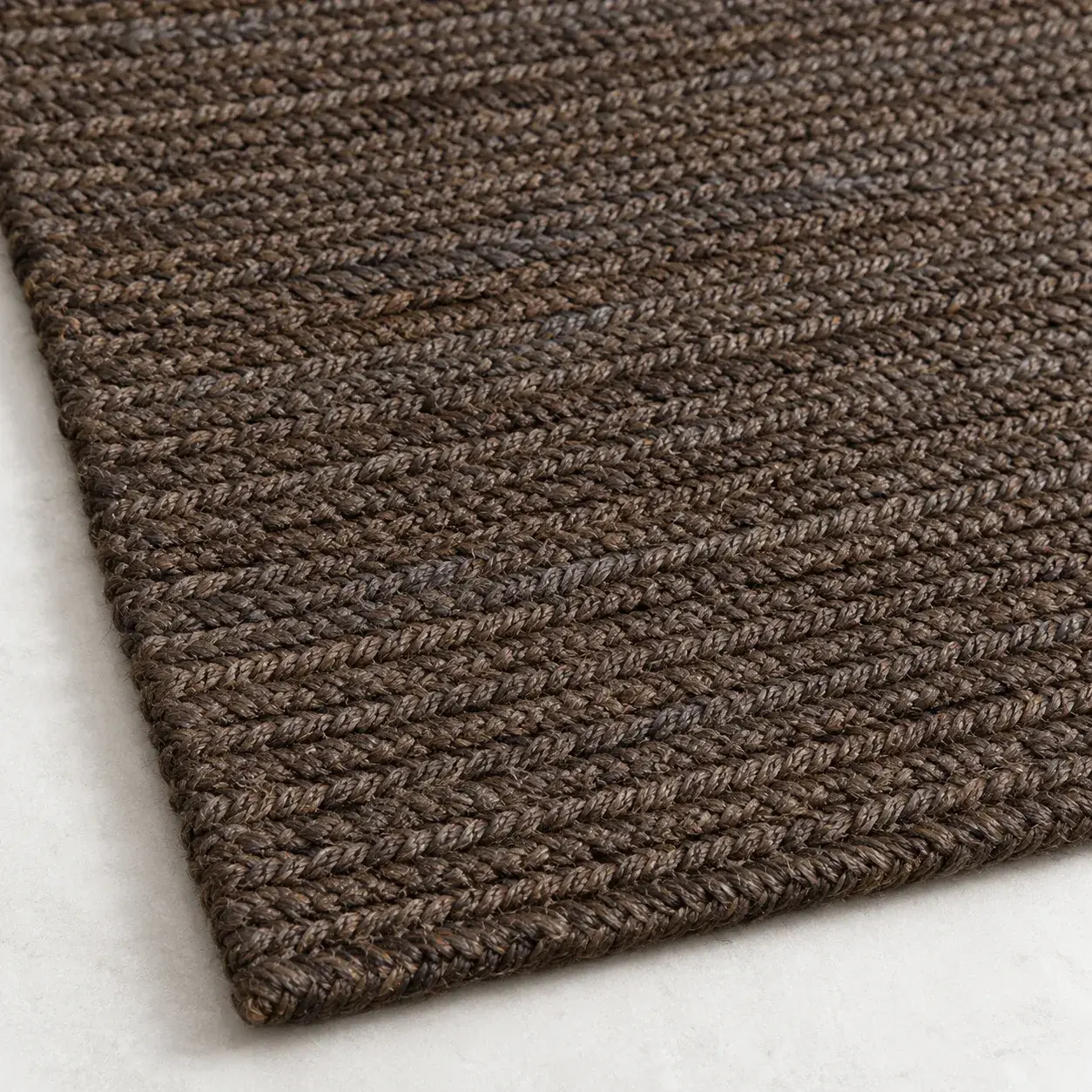 Close view of the Horatio Rug in charcoal showing its texture and detail