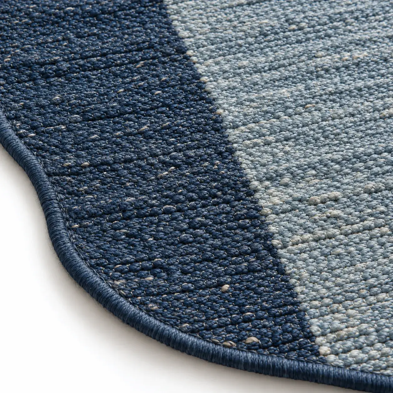 Maddox Rug in blue cream styled in a room, digitally rendered
