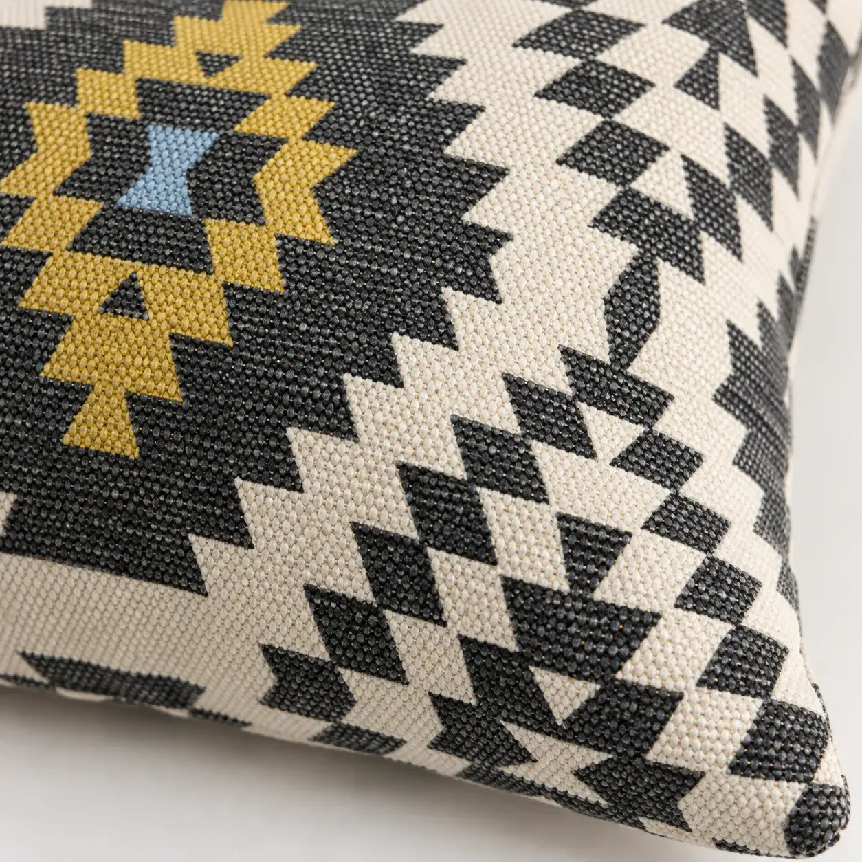 Close view of the Neve Cushion Cover showing its texture and detail