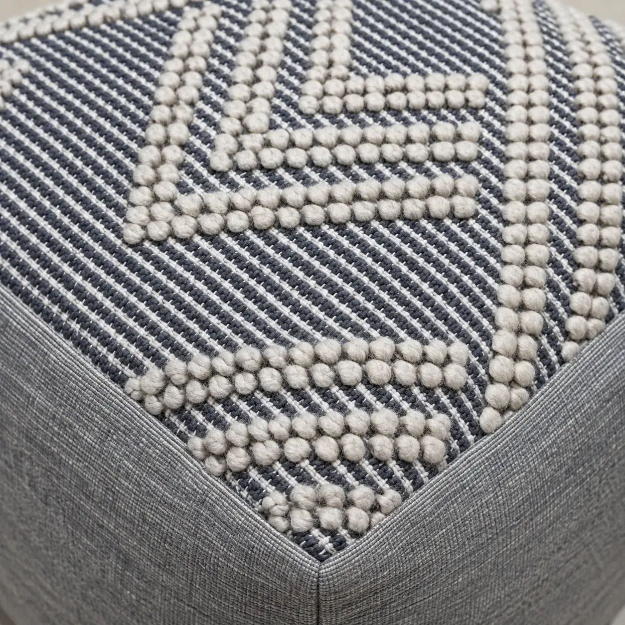 Close view of the Nico Pouf showing its texture and detail