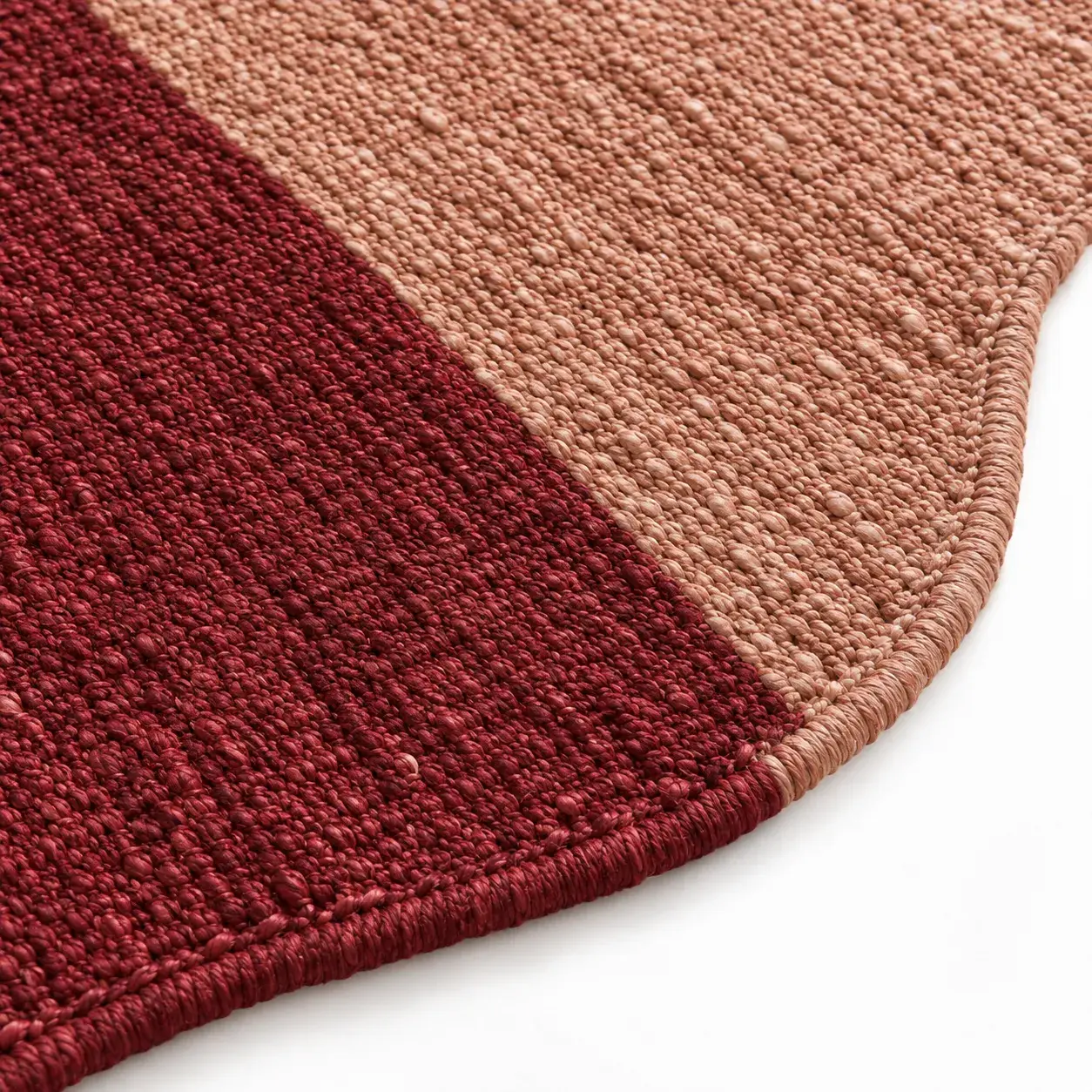 Peregrine Rug in burgundy rose styled in a room, digitally rendered