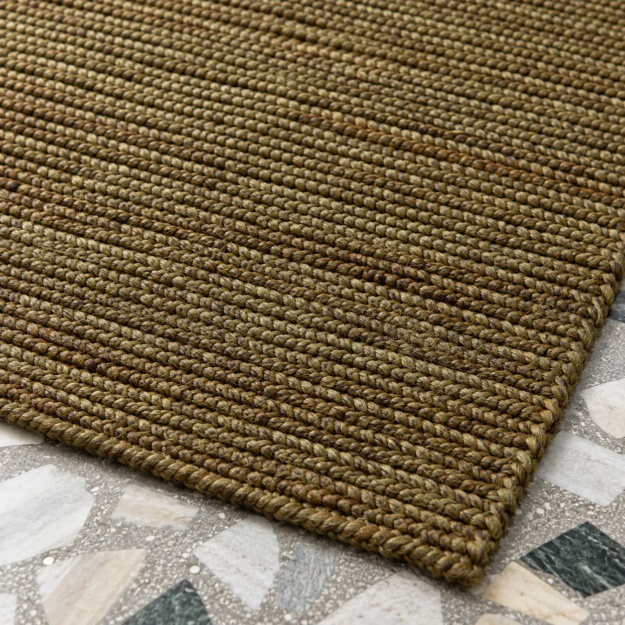 Close view of the Persephone Rug in sand showing its texture and detail