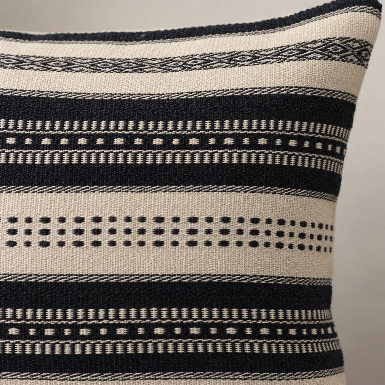Close view of the Renzo Cushion Cover showing its texture and detail