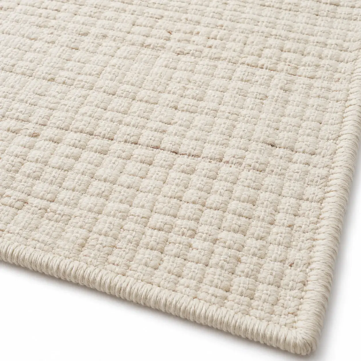 Close view of the Tamsin Rug in beige showing its texture and detail