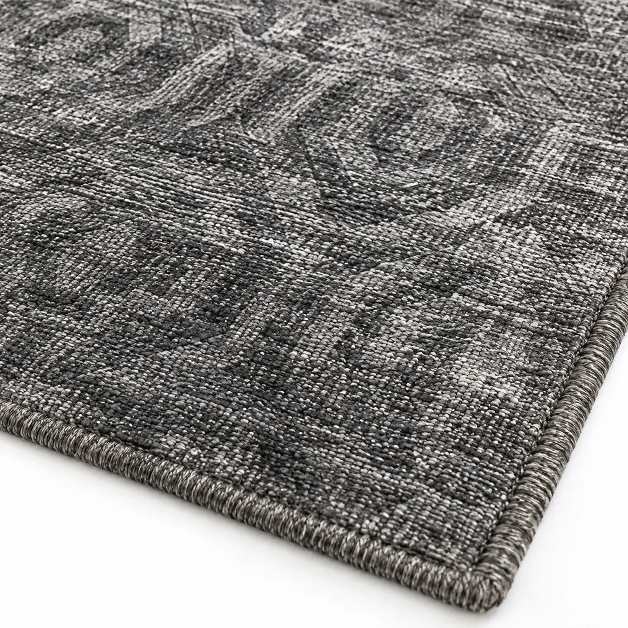 Close view of the Wenzel Rug in dark grey showing its texture and detail