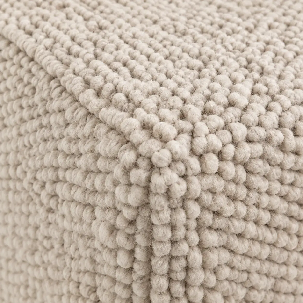Close view of the Arlo Pouf showing its texture and detail