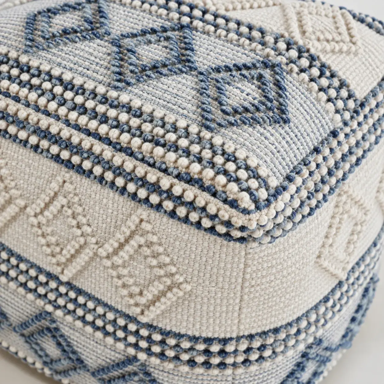 Close view of the Beau Pouf showing its texture and detail