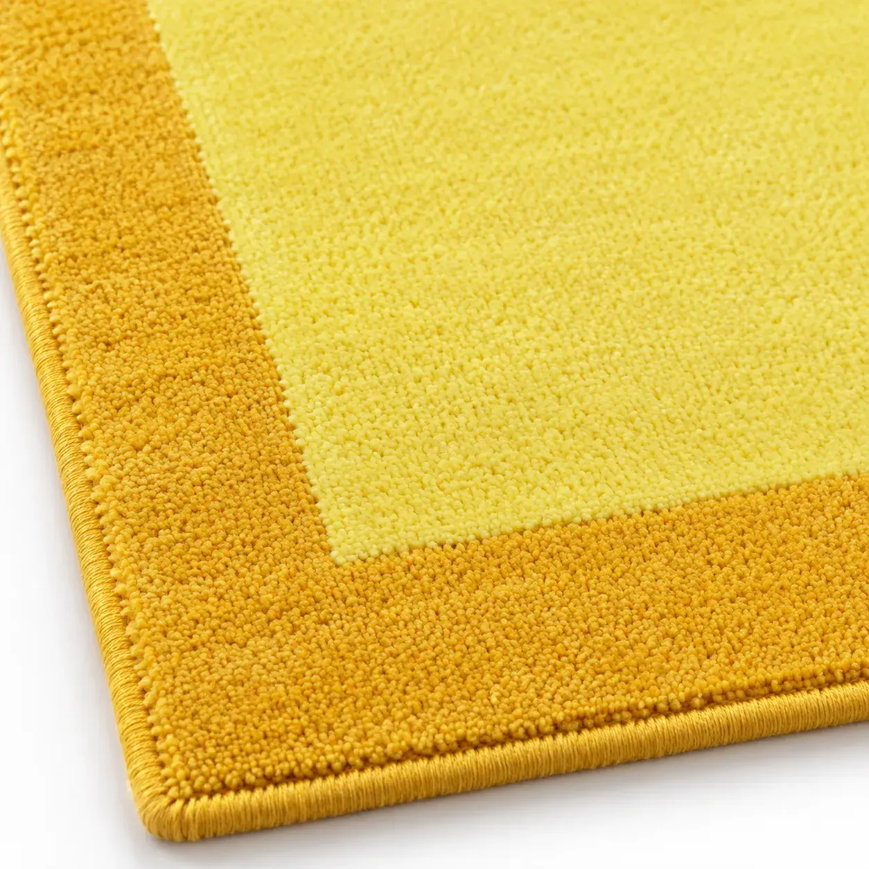 Close view of the Bobbin Rug in yellow showing its texture and detail