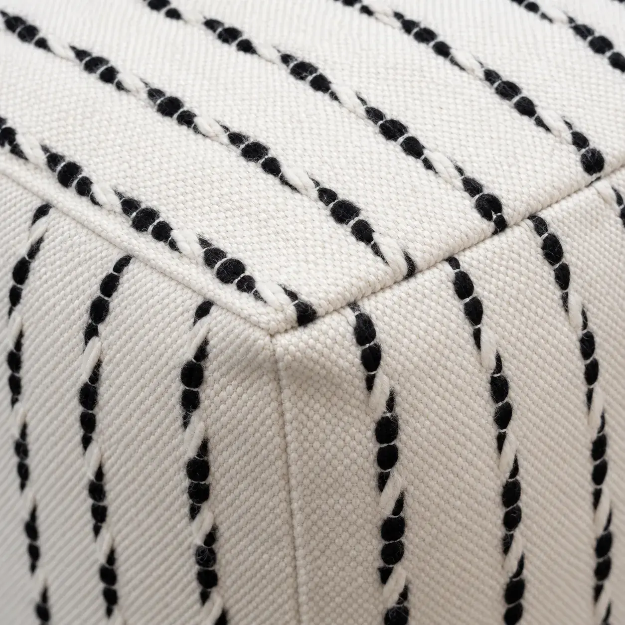 Close view of the Cato Pouf showing its texture and detail