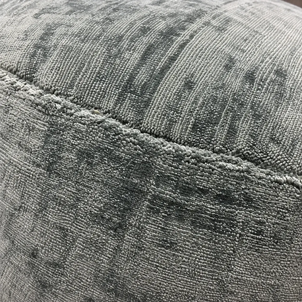 Close view of the Cosmo Pouf showing its texture and detail