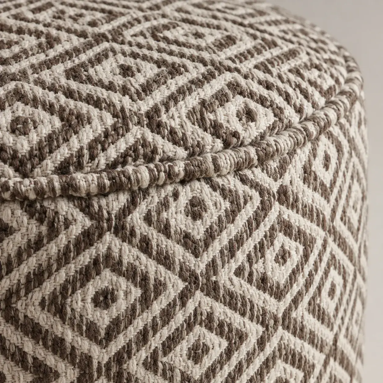 Close view of the Ivo Pouf showing its texture and detail