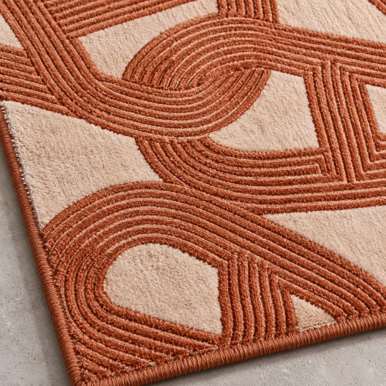 Close view of the Theron Rug in terracotta showing its texture and detail